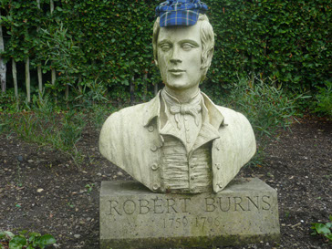 Somebody thought statue of Scotland's world reknowned poet Robert Burns needed an Italian National Tartan cap to keep its head warm