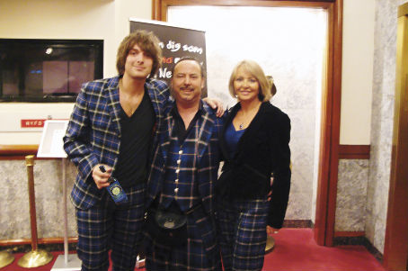 Mike and Annette Lemetti relax with Paolo Nutini after the show at Get Kilted in New York still wearing the Italian National Tartan