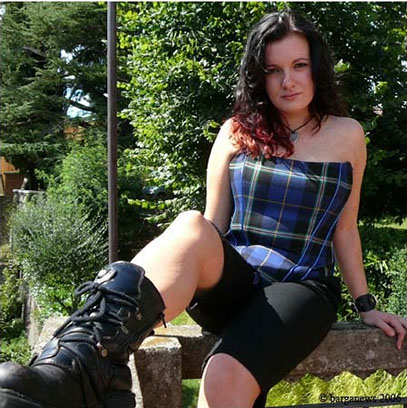 Scottish musician Adriana Spina dresses up in Italian National Tartan corset top in Barga